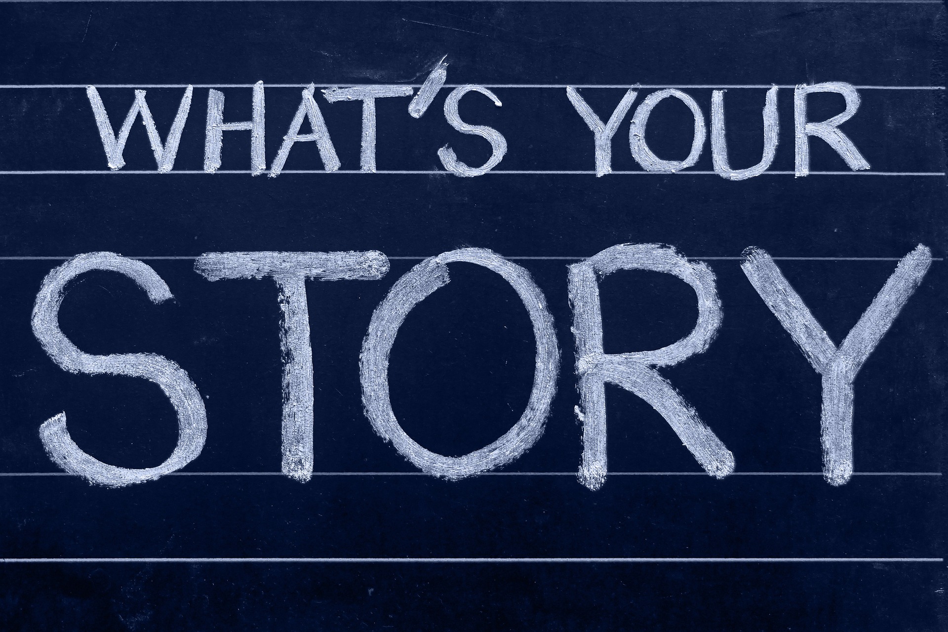 A blackboard with the words "What's your story?" written in white chalk on it.